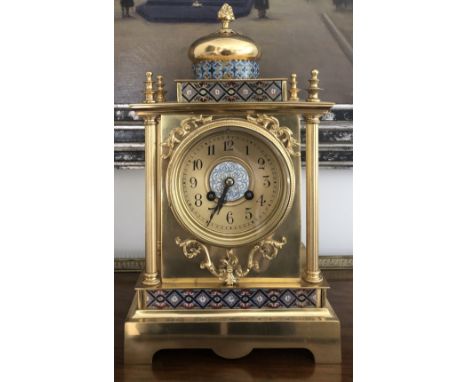 A brass mantle clock with enamel decoration. 37cms h.Condition ReportAppears to be in good working order, no noticeable fault