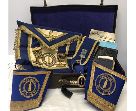 A Yorkshire West Riding Masonic apron, sash with silver Calcaria lodge masonic jewel and cuffs with bible, masonic book etc i