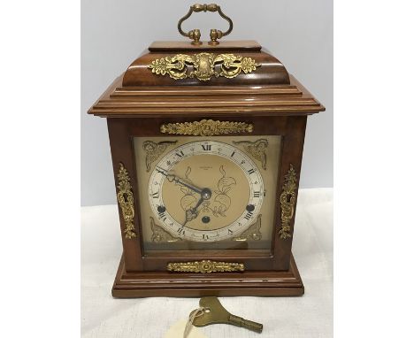 Mahogany cased Elliot mantle clock with Westminster chime and brass decoration. Carmichaels of Hull. Has key. 33cm h x 23cm w