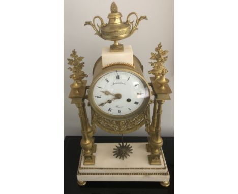 A 19thC French gilt and white marble portico clock, dial signed Archambaut Aaria. 48cms h x 26cms w x 11cms d.&nbsp;