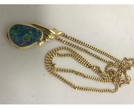 An opal and diamond pendant on 18ct yellow gold on a 9ct flat link chain, 9gms total weight.