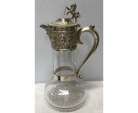 Silver mounted claret jug, lion handle, clear shield cartouche, Bacchus pourer and grape and vine decoration, Henry Wilkinson