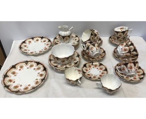 Victoria Melba china part tea set, 2 cake plates. 12 side plates, milk jug, sugar bowl, 11 cups. Condition ReportTwo cups wit