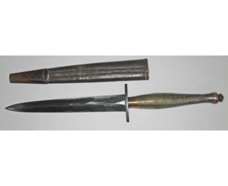 A WWII Fairbairn Sikes 2nd pattern FS fighting knife and leather scabbard.Condition: blade has only surface wear, no chips or