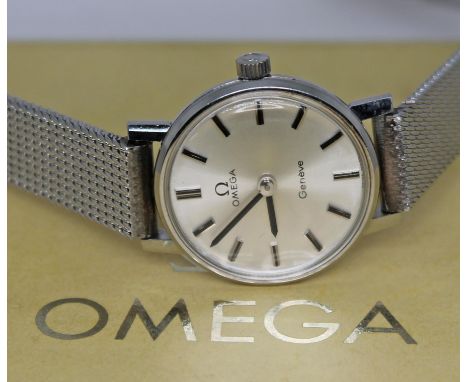 A ladies 1970s Omega Geneve 511.0457 stainless steel wristwatch with silver tone signed dial, hands and hour markers in black