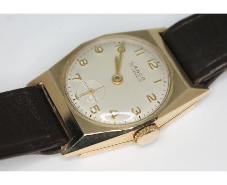 A gents Lanco Art Deco style hallmarked 9ct gold manual wind wristwatch with white signed dial, Arabic numerals and hands in 