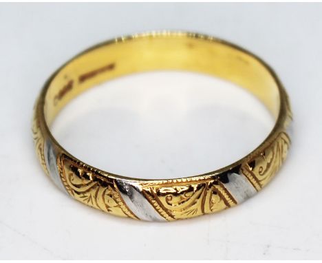 A 22ct two colour gold wedding band, marked '916', wt. 4.36g, size R.