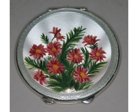 A hallamrked silver and enamel compact, diam. 6.8cm.  