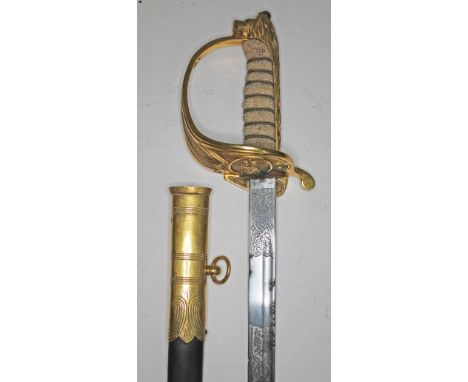 An Elizabeth II Navy officer's sword, the etched blade signed Gieves, with folding gilt brass hilt and guard, wire bound hand