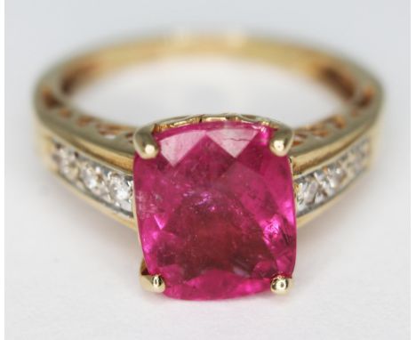 A 14ct gold ring set with a mixed cut pink stone, gross wt. 3.49g, size L.  