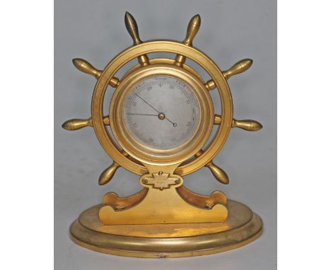 A gilt metal novelty barometer formed as a ship's wheel, Mansfield Dublin, height 19cm.  