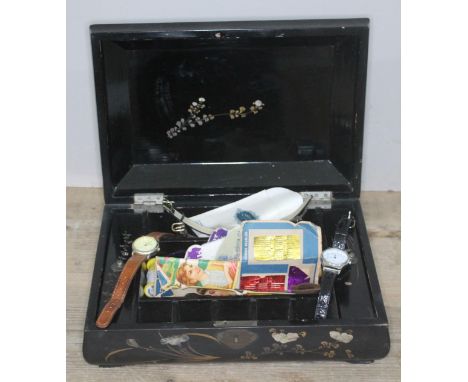 A Japanese sewing box and contents including two hallmarked silver and mother of pearl pen knives, other pen knives, watches 