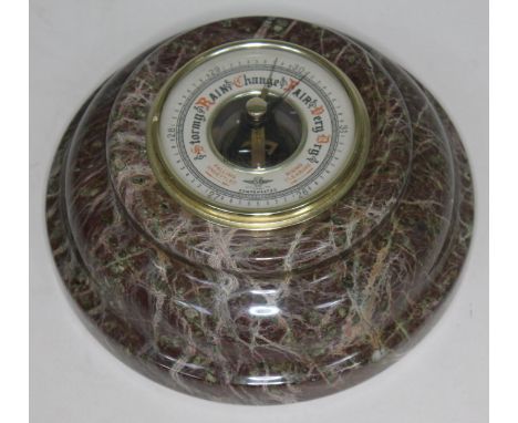 A compensated barometer by Smiths, within Scottish granite round frame, diam. 17.5cm.  