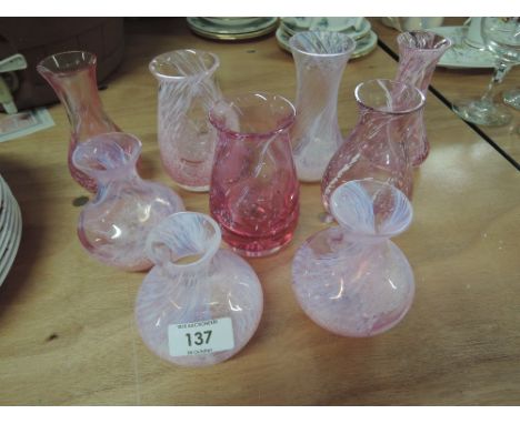 A collection of Caithness pink glass vases various styles