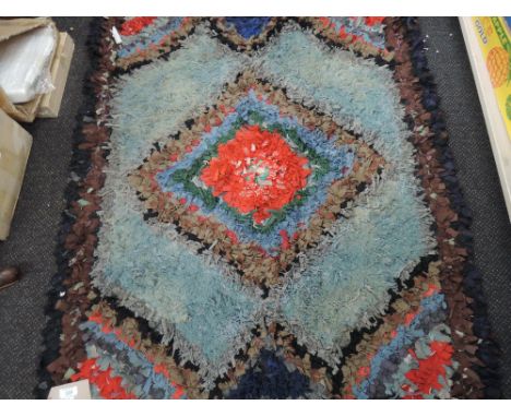 A vintage pegged rug (diamond centre)