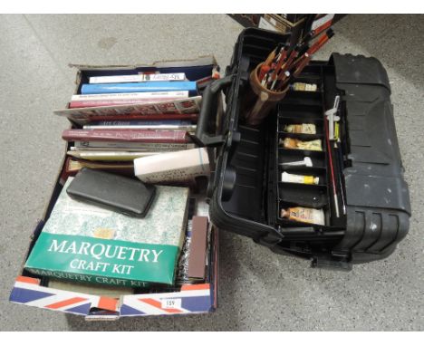 A box of artists equipment and books including acrylic and oil paint, pallets, pencils and artists toolbox
