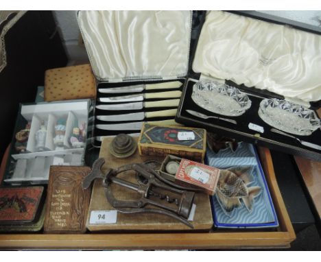 A miscellaneous collection including tapestry tray, cigarette case, selection of flatware, butter dishes and various weights 