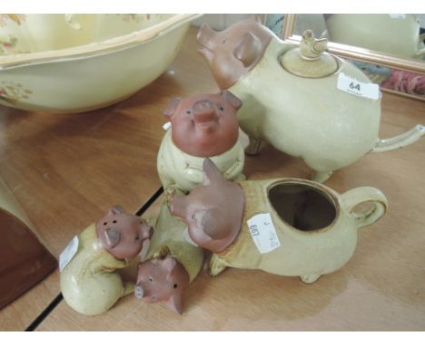 A selection of ceramic pig designed teapot A/F, milk jug, jam pot and salt and pepper pots