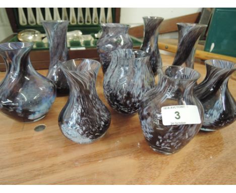 A selection of Caithness glass in purple speckled pattern