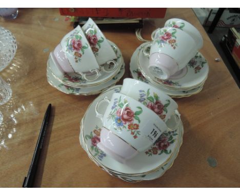 A Colindale part tea service with pink floral and gilt design