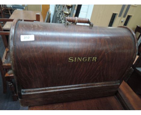 A vintage Singer hand sewing machine in case