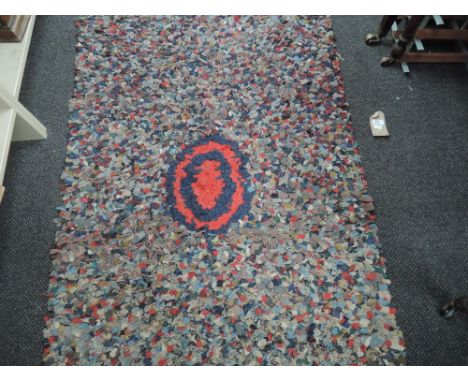 A vintage pegged rug (circle centre)