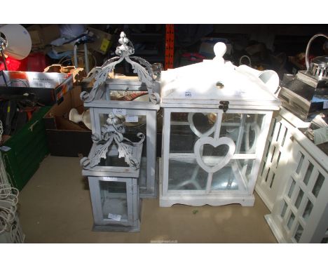 Two large candle lanterns, 22" high x 9"and 15" high x 16" and white candle lantern 19 1/2" x 13".