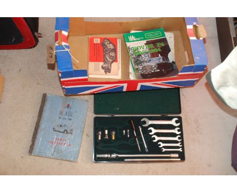 Jaguar toolbox, kit-spanners, light bulbs, etc. and a manual for a classic Rover 80 and 100 parts catalogue, etc.