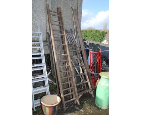 Seven rung wooden stepladder and nine rung wooden extension ladder.