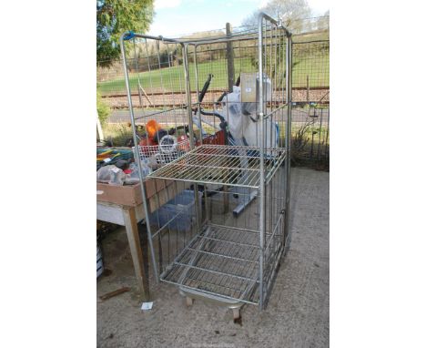 Large zinc plated supermarket trolley with adjustable shelf on swivel castors, 32" x 28" x 68".