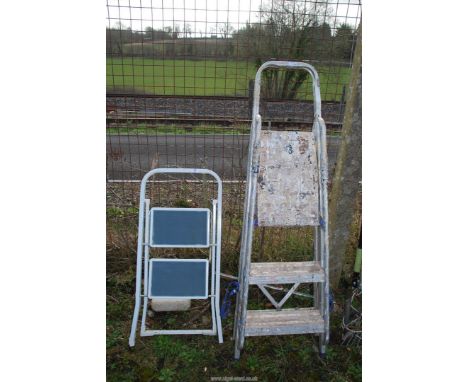 Three rung metal stepladder and two step stepper.