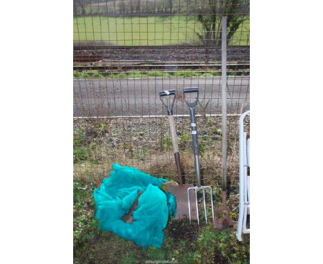 Hoe, spade, fork, lump hammer and garden netting.