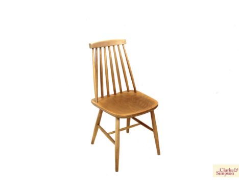 A pair of Ercol style stick back kitchen chairs 