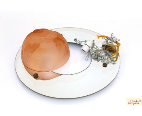 An Art Deco ceiling light fitting, the pink glass shade decorated with doves, set of a mirrored surround, 46cm overall