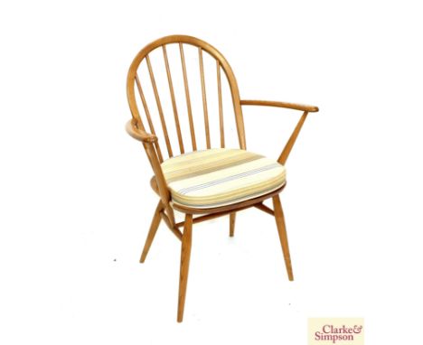 A light Ercol stick back elbow chair 