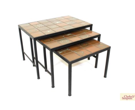 A nest of three tile top and metal graduated coffee tables, 67cm wide 