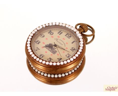 A pocket watch with faux enamel decoration of a girl and imitation pearl surround