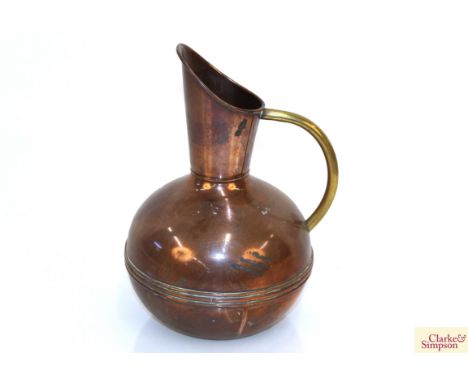 A copper baluster pitcher in the manner of Dr Christopher Dresser, with brass handle, 25cm high