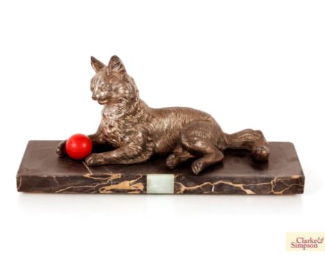 A spelter figure of a Louis Wain type cat with ball
