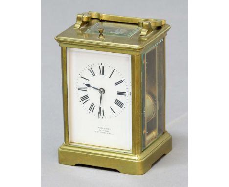 FRENCH BRASS FOUR PANE CARRIAGE CLOCK, the enamelled dial inscribed MacMichael/To The King/48 Sth Audley Street on a brass, e