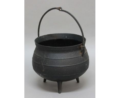 CAST IRON CAULDRON, with swing handle and tripod base, height excluding handle 33cm, diameter 40cm