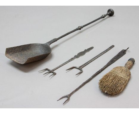 THREE IRON COOKING OR TOASTING FORKS, including one of trident form, together with an iron shovel and a brush, shovel 73cm (5