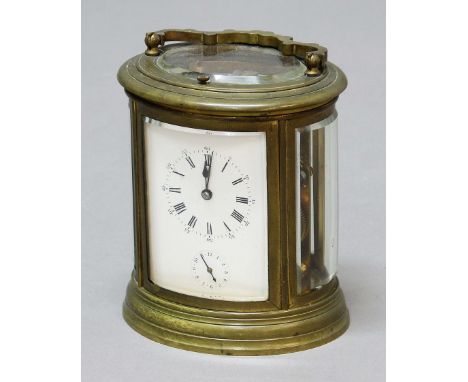 FRENCH OVAL BRASS CARRIAGE CLOCK, the enamelled dial with subsidiary alarm dial, the eight day movement with repeater and ala