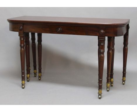 REGENCY MAHOGANY CONCERTINA ACTION EXTENDING DINING TABLE, by Wilkinson Moorfields, London, early 19th century, the rounded r