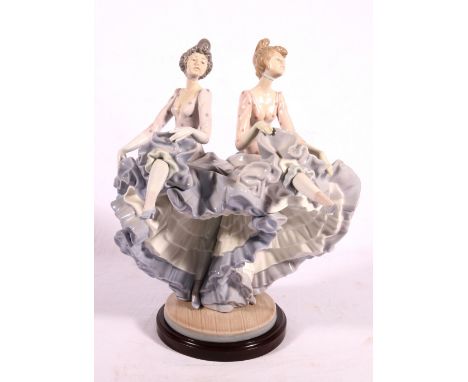 Lladro porcelain group of dancers, model no, 5370, on wooden stand, 32cm. CONDITION REPORT: Small nibbles to underside of foo
