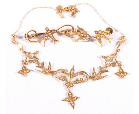 Gold necklace modelled as swallows among scrolls "14 K", the matching earrings and a similiar brooch with pearl swallow upon 