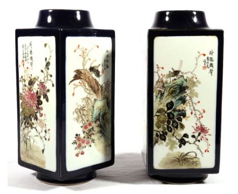 Pair of 20th Century Chinese blue ground vases of t'sung form, painted with panels of insects and flowers, red seal mark to b