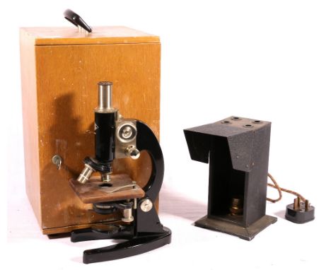 Chrome and black lacquer monocular microscope by Prior of London, with rack and pinion focusing, triple nosepiece and four sh
