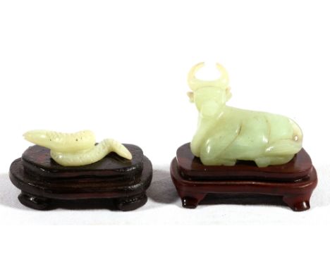 Chinese jade carving of a bullock with stand and another of a snake, 5cm and 4.5cm, stand. (2)
