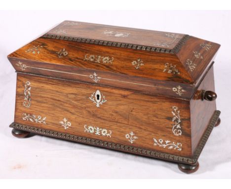 Victorian mother of pearl inlaid rosewood srcophagus tea caddy, on bun feet, 33cm.